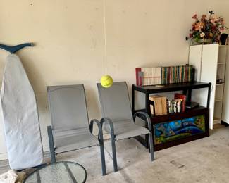 Patio chairs, metal art, books, ironing board