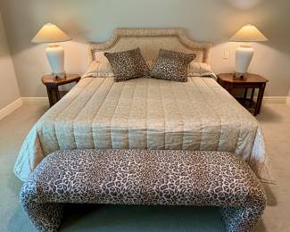 Stunning upholstered king size bed and leopard bench.