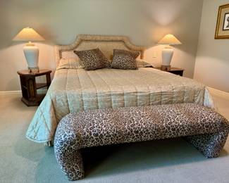 Stunning upholstered king size bed and leopard bench.