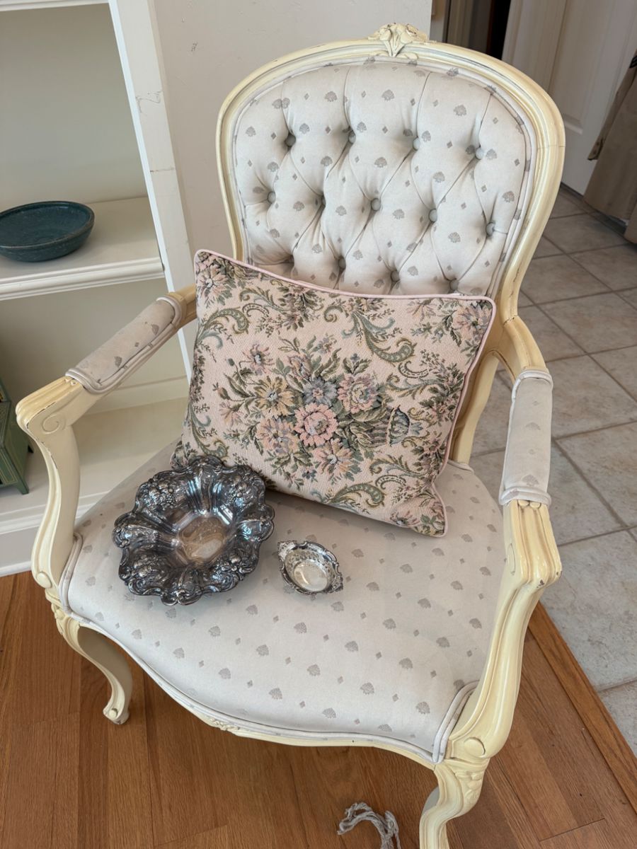 One of a pair of Tufted arm chairs, sterling