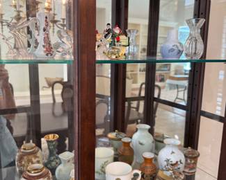 Child dishes, Satsuma, cloisonné, hummels, etc in lighted display cabinet