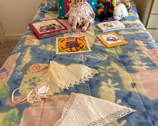 Twin beds, dolls, books
