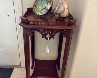 Elegant gallery-top accent table