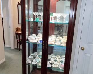 Outstanding lighted display case w/ beveled glass doors