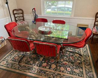 This picture shows both the oval glass-top/driftwood dining table and the six matching Made in Italy chairs.