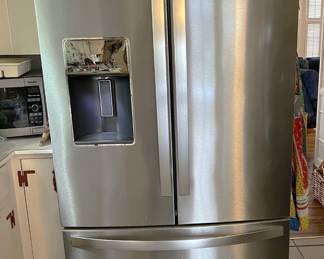This is a Whirlpool side-by-side, freezer on the bottom refrigerator. Stainless steel, too.