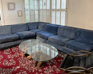 With the table and rug you can see the Marge Carson suede sectional sofa.