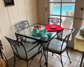 This iron-framed table and chair set is also glass-topped...I'm sensing a theme here.