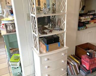 Here is a really cute three-drawer cabinet with a set of shelves above it.