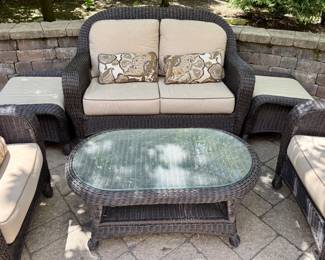 6 Pc Outdoor Wicker Seating Group with a Loveseat, 2 Matching Chairs and Ottomans and Coffee Table with Cushions by Sunbrella.