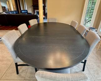 Oval Dining Table with 8 Slipper Chairs in Light Tan. Perfect for an Eat-In Kitchen or Dining Room