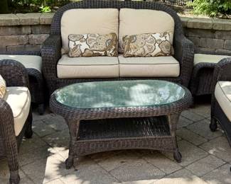 6 Pc Outdoor Wicker Seating Group with a Loveseat, 2 Matching Chairs and Ottomans and Coffee Table with Cushions by Sunbrella.