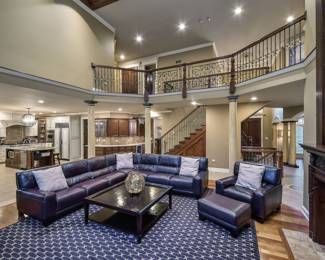 Family Room Featuring: Chateaux D'Ax Leather Sectional, Loveseat and Chair/Ottoman from Macy's Furniture in Oak Brook