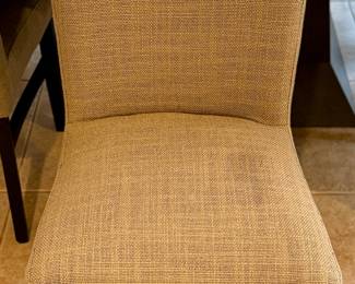 Oval Dining Table with 8 Slipper Chairs in Light Tan. Perfect for an Eat-In Kitchen or Dining Room