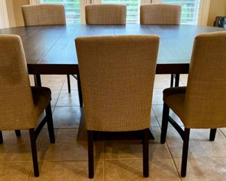 Oval Dining Table with 8 Slipper Chairs in Light Tan. Perfect for an Eat-In Kitchen or Dining Room
