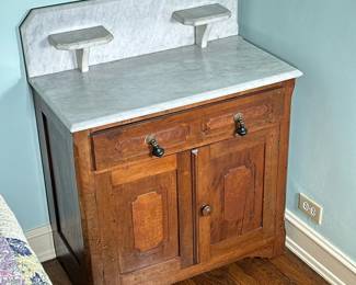 English (Victorian) Style Marble Top Washstand | Antique (possibly 1800's) English (Victorian) Style marble top washstand/basin table with lower cabinet.
- h. 36.25 x w. 30 x d. 16 in