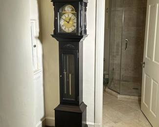 Grandmother Clock in Dark Finish | Vintage Colonial style grandmother clock in a dark finish with roman numerals face and hanging chimes. - h. 71.25 x w. 14,75 x d. 10 in