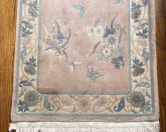 Rose-Colored Oriental Rug - Runner | Oriental runner rug (2' x 10') with blue florals atop a rose-colored base. - w. 27 x l. 126 in