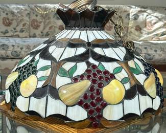 Tiffany Style Fruit-Patterned Light Fixture | Tiffany style stained glass/slag glass hanging light fixture with fruit design and decorative chain.
*Height to top of fixture not including chain
Dimensions: h. 14 x dia. 21 in (*)