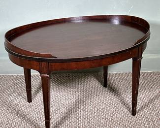 Wooden Oval-Shaped Coffee Table | Wooden oval-shaped coffee table in dark finish. - h. 17 x w. 29.75 x d. 21 in