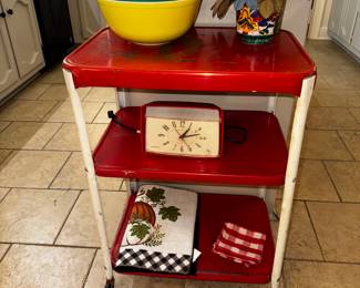 Vintage red and white rolling kitchen cart.