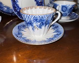 Flow blue teacup set