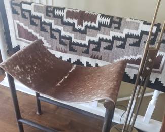 Pair of Jan Barboglio Cowhide and steel stools and Navajo rug