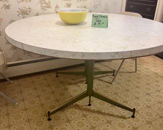 Round formica kitchen table, with green veining. Excellent condition for age.