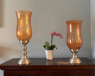 Orange hurricane candle holder; 21 inch and 17 inch.
These will look especially great in any common living space.