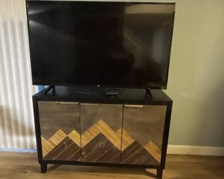 Sideboard store items for electronics or additional dishware. 3 doors - with 1 shelf behind each door 32 x 16 x 47.
52 inch LG large flat screen television is for sale too.