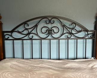Queen size bed with iron rod headboard. Bed frame has 4 - post. This frame style will nicely accent any bedroom