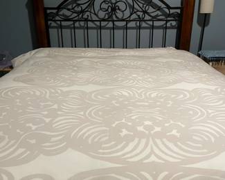 Queen size bed with iron rod headboard. Bed frame has 4 - post. This frame style will nicely accent any bedroom.