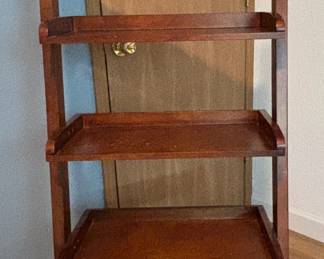 Brown open book shelf with 5- shelves. 55.5H x 15D x 24 W