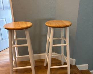 2- white leg, tan seat kitchen bar stools. 30 inches H