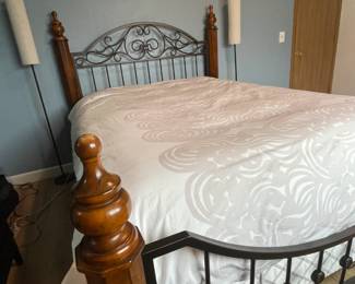 Queen size bed with iron rod headboard. Bed frame has 4 - post. This frame style will nicely accent any bedroom.