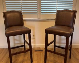 Tall : 2 very comfortable brown bar stools. Great for any room, kitchen, living, family gathering space and also a bar. 44 inches total, 29.5 inches from the floor to the seat.