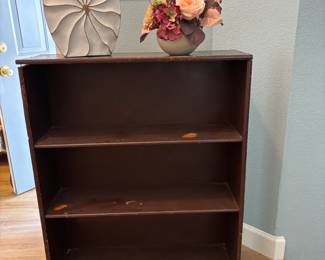 Brown, 2-shelf bookcase. 36 x 9.5 x 29. Needs paint or wood stain color.