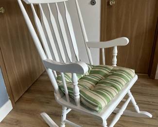 White rocking chair. This item will work well in any area of the home, including the nursery.