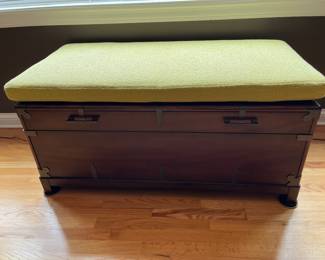 Wood storage trunk with upholstered seat cushion......