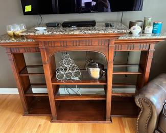 Display shelf with stone top and glass shelves