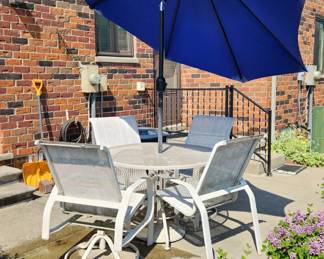 Patio table and chairs with umbrella