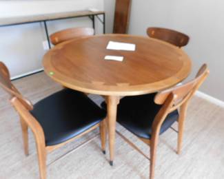 Lane table from the previous photo, broken down into the small round with four chairs. Beautiful inlay on the table and chair backs. Includes 2 leaves to expand to seating for 6.