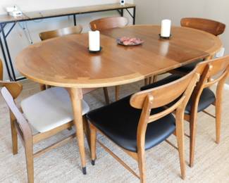 Please note, the white chairs have been added to this set to make a table for 6 by the client and have been removed. The white chairs are still in the home, but have been places with another set. This table is for the 4 black chairs with inlaid wood. and the inlaid wood table with two leaves.