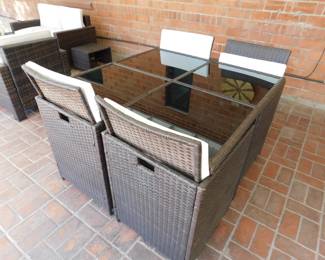 This set had fold down chair backs, and a foot stool under every chair. The chair and foot stool will slide as a unit under the table for sun/ wind protection!