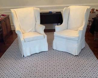 Two White Covered Chairs With Elegant White Blue Rug
