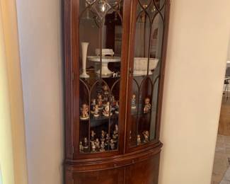 Corner cupboard with Hummels, Lenox, German crystal