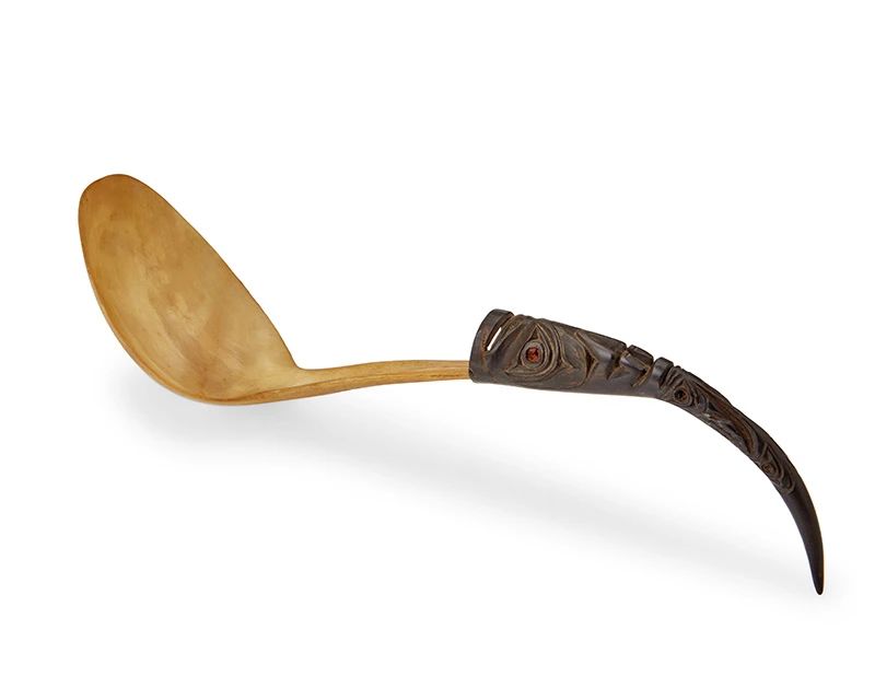 1
A Northwest Coast carved horn and wood spoon
20th century
Likely Tlingit or Haida, the carved goat horn potlatch spoon with a figural totemic carved wood handle featuring an inset abalone shell eye
16" L x 3.625" W x 6" D
Estimate: $500 - $700