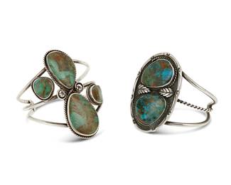 221
Two Southwest sterling silver and turquoise cuff bracelets
Late 20th century
One with etched letters verso: LMT
Each three-wire cuff with set turquoise to large and small plaques, and with silver overlay and stamped accents
Larger: 6.5" total inner C x 3" H, including a 1.25" gap; smaller: 6.5" total inner C x 2.625" H, including a 1.375" gap
114.9 grams gross
Estimate: $200 - $400