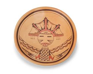 244
Dawn Navasie (b. 1961, Hopi-Tewa)
A polychrome yellowware pottery low bowl, late 20th/21st century
Signed to underside: Dawn Navasie [stepped banding motif]
The large tray with central katsina figure and black band to rim
2.5" H x14.5" Dia.
Estimate: $500 - $700