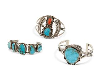 222
A group of Southwest-style sterling silver and stone set cuff bracelets
Late 20th century
One marked: TB [gothic font; likely Tom Burnside, Diné, active 1970s]
Three two-wire cuffs comprising a chunky Tom Burnside Navajo chunky cuff with large central set turquoise and silver overlay and stampwork, as well as a delicate wide cuff with set turquoise and coral flanked by silver feather accents, and a small cuff with five graduated set turquoise stones
3 pieces
Largest: 6.5" inner C x 1.875" H, with a 1.375" gap; smallest: 6.25" inner C x 1" H, with a 1.5" gap
89.8 grams gross
Estimate: $400 - $600